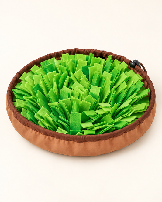 Grass-green felt snuffle mat with a tan drawstring edge on an ivory background.
