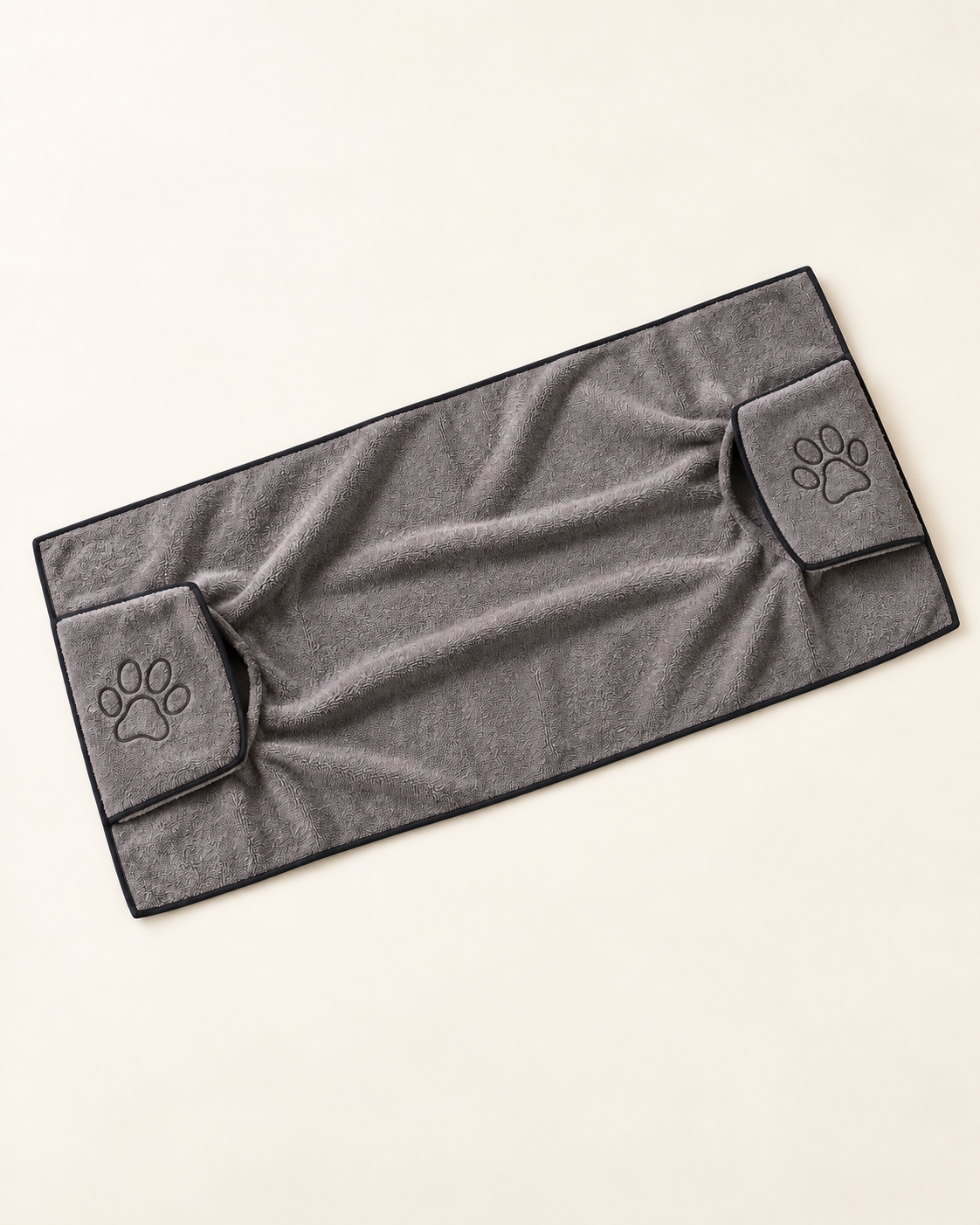 Gray rectangular microfiber dog drying towel with dark edging and two paw-embroidered hand pockets.